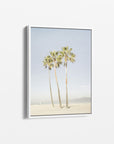 The Offley Green Set of 4 Framed Canvas 24x30 features a tranquil botanical scene with four tall palm trees on a sandy beach against a clear blue sky, complemented by the distant ocean for added serenity. Choose from multiple combinations to enhance your space with natural charm.