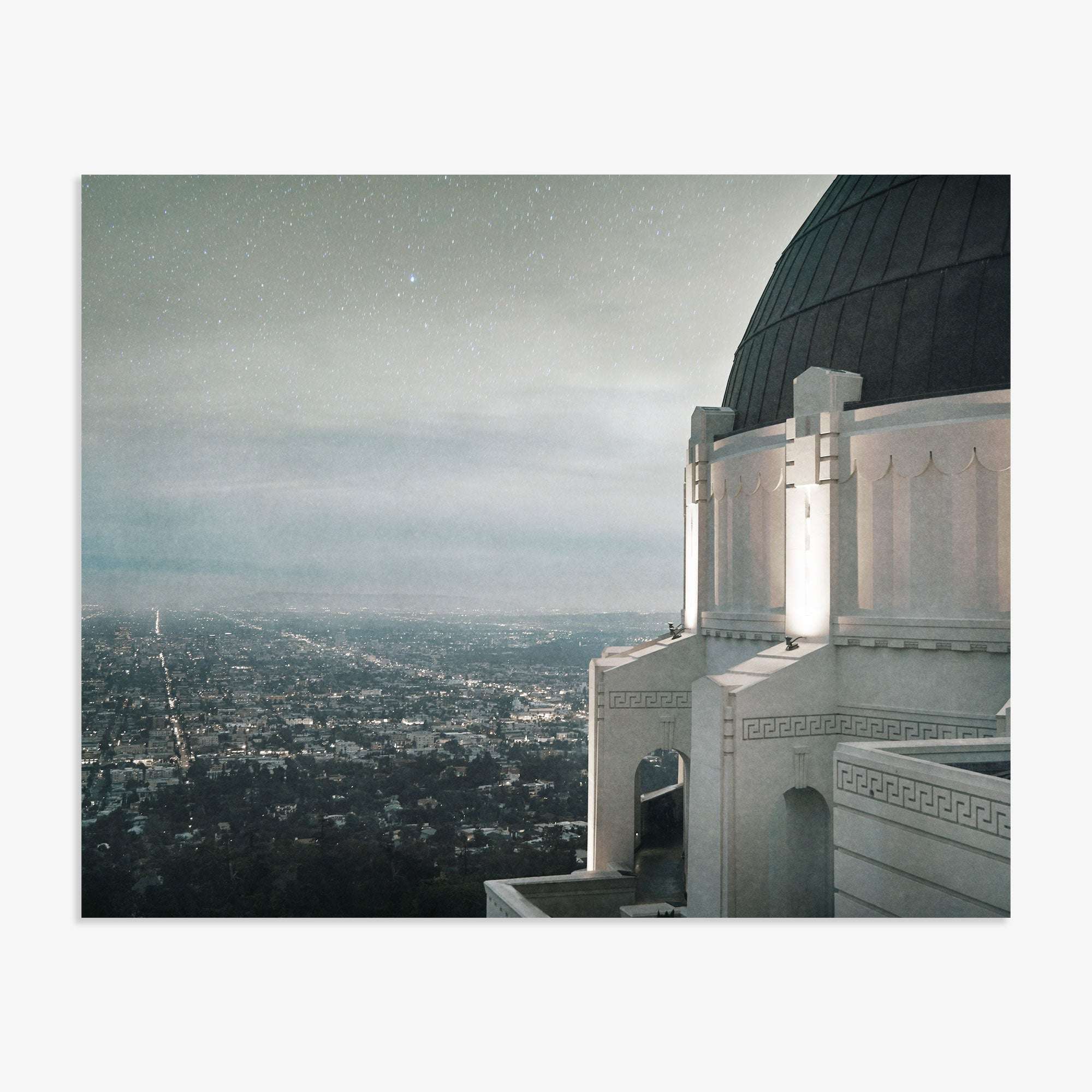 A nighttime view from the Offley Green Griffith Observatory Print, &#39;The Sky At Night&#39; overlooking a sparkling Los Angeles cityscape under a starry sky, with the observatory&#39;s dome and ornate architecture in the foreground.