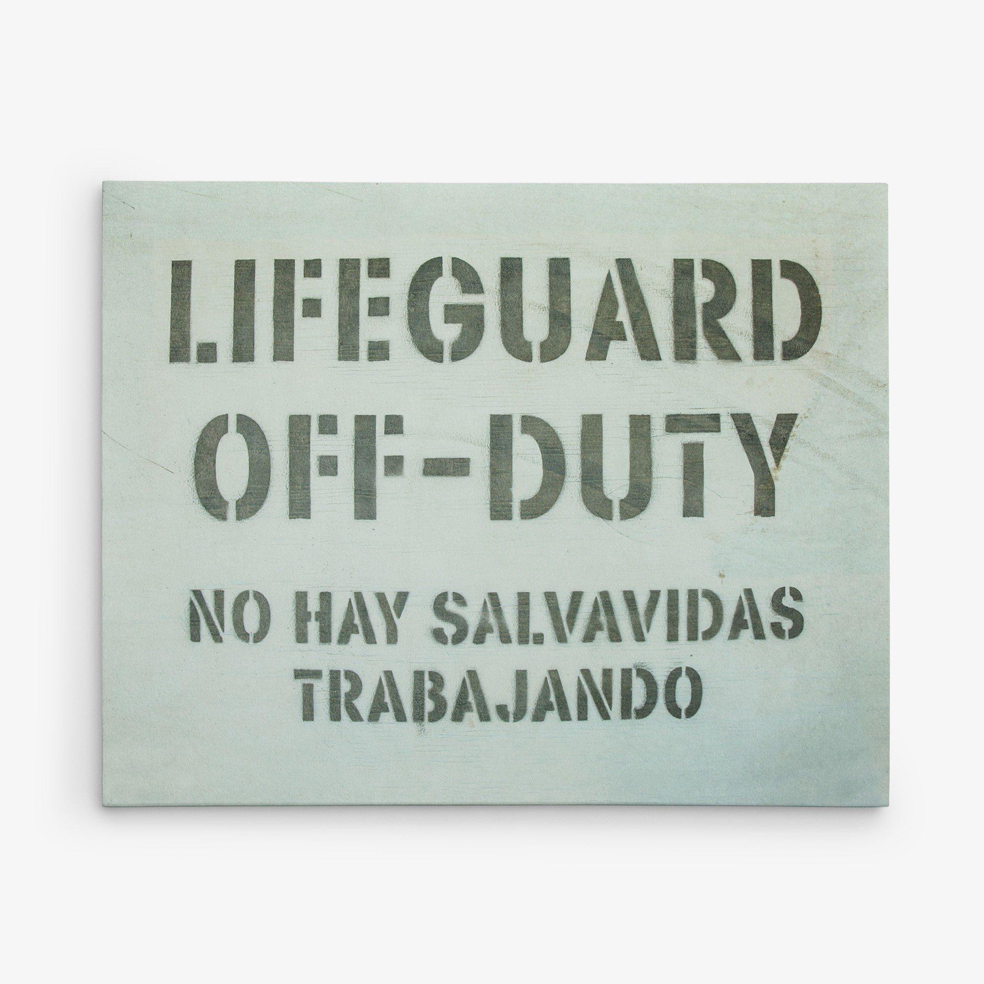 An 11x14 California Canvas Print (Choose from 10+ Designs) by Offley Green featuring a sign with bold stenciled text reading &quot;LIFEGUARD OFF-DUTY&quot; in English and &quot;NO HAY SALVAVIDAS TRABAJANDO&quot; in Spanish against a light background, perfect as wall art for those who love California prints.