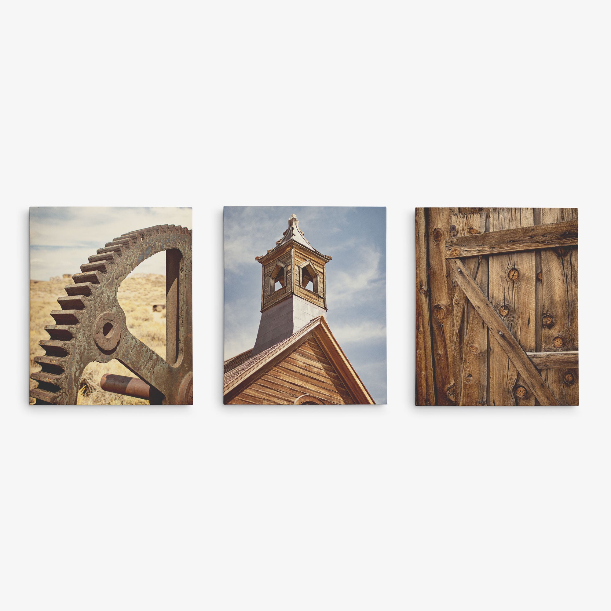 Offley Green offers a Set of 3 Canvas featuring a rusty gear against a barren landscape, a wooden building&#39;s steeple under a blue sky, and an old wooden door with metal hinges. Choose from multiple combinations for premium artist-grade displays.